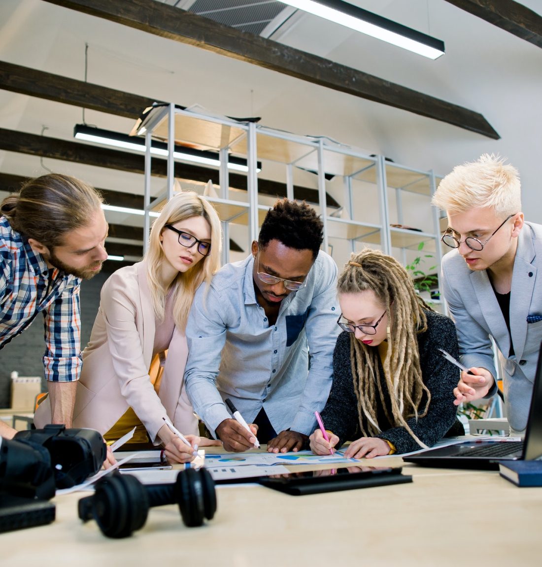 creative-multiethnic-team-of-five-skilled-young-colleagues-working-with-data-and-marketing-charts-in.jpg